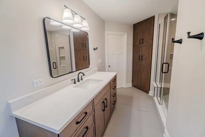 Spacious and luxurious master suite bathroom with lots of storage space and a path for going to and from the bedroom