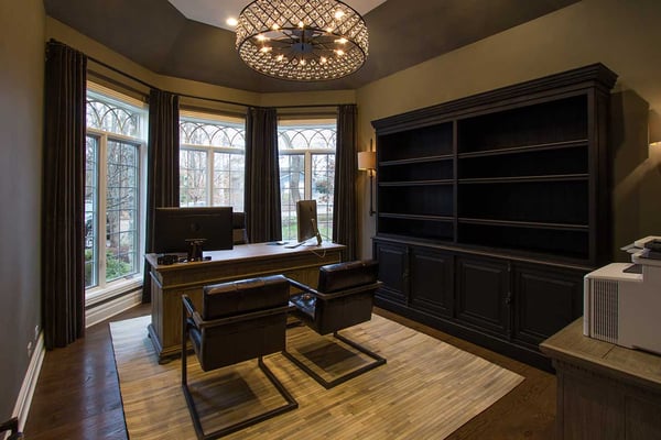 Luxurious home office or home conference room with two side by side chairs and a crystal chandelier