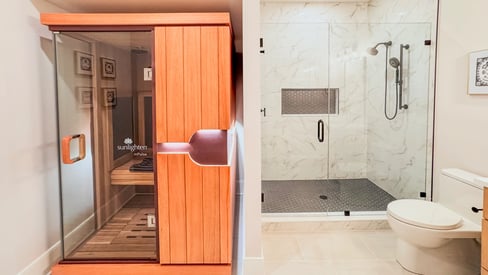 A basement guest bathroom with a walk-in shower and an individual sauna