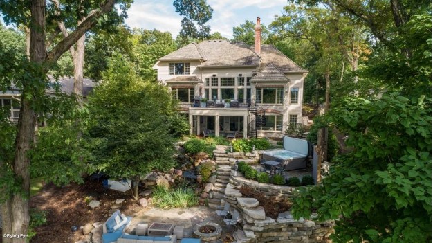 Backyard with stone walkway and pool