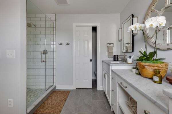 McQuire Place Bathroom Makeover With Glass And A Pocket Door Ensuite by Hogan Design