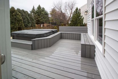 back porch with grey trexdecking and a hot tub