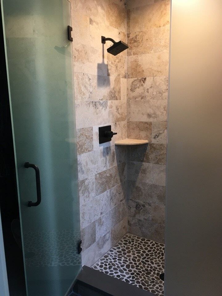 Walk-in shower with pebble-stone floor