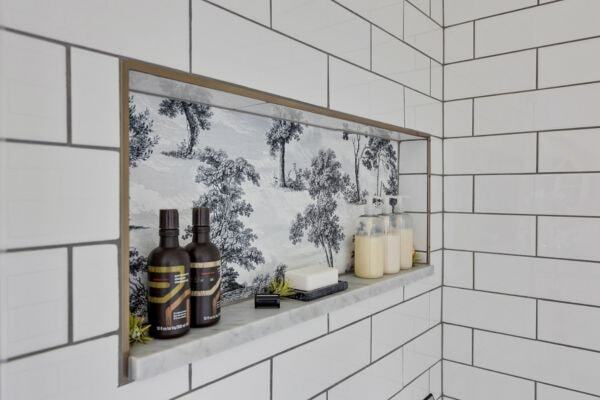Receessed shower niche with toile wallpaper