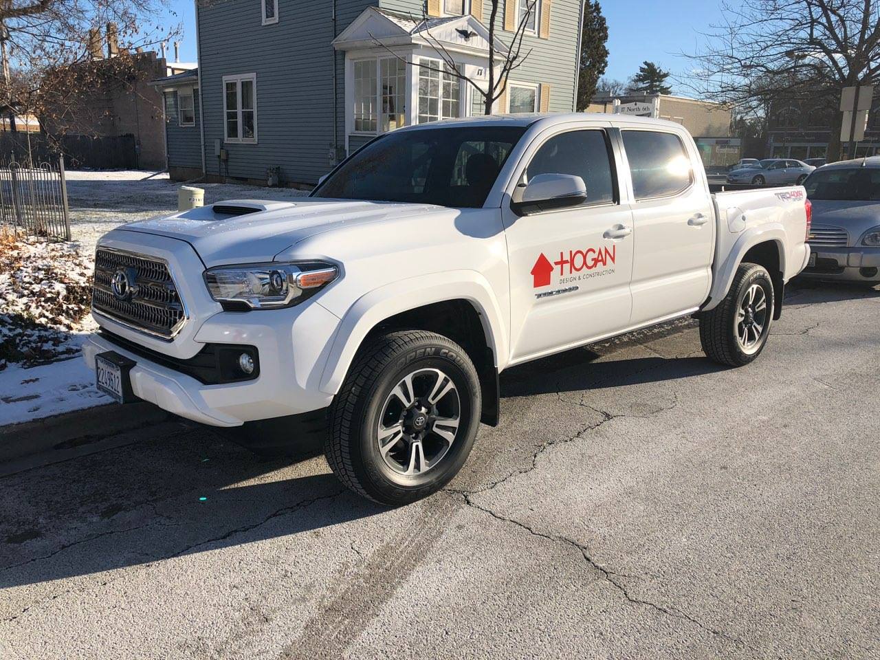 Toyota Tundra truck with red Hogan logo on side