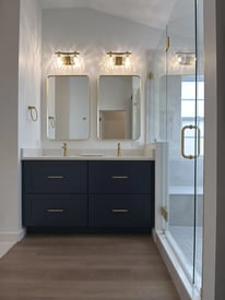 Storage space with drawers on both sides of a double bathroom vanity