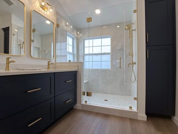 Wide, low-angle photography of a newly remodeled and elegant master bathroom
