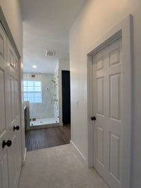 Hallway entrance to a luxurious master bathroom remodel