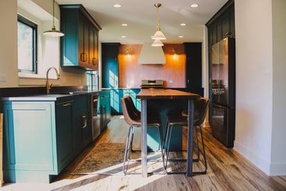 Kitchen island with pull-out high-boy chairs for extra seating areas within the kitchen