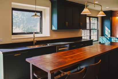 Hardwood extension of the kitchen island that features additional seating to entertain/host guests