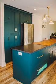 Functional kitchen island with space to prepare food and outlets mounted on the side