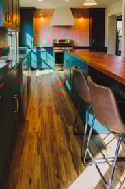 Hardwood flooring in a new kitchen remodel designed to give more space to the home