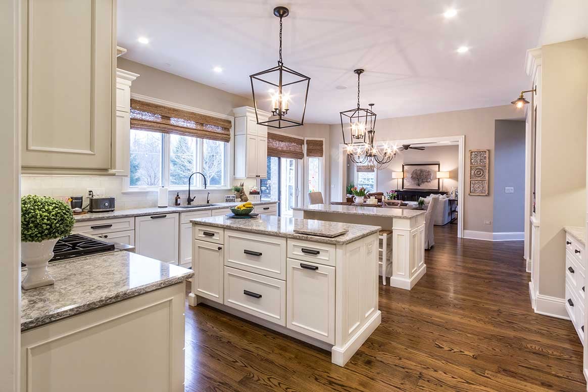 High-end kitchen remodel with hardwood floors and lots of warm/neutral beige colors