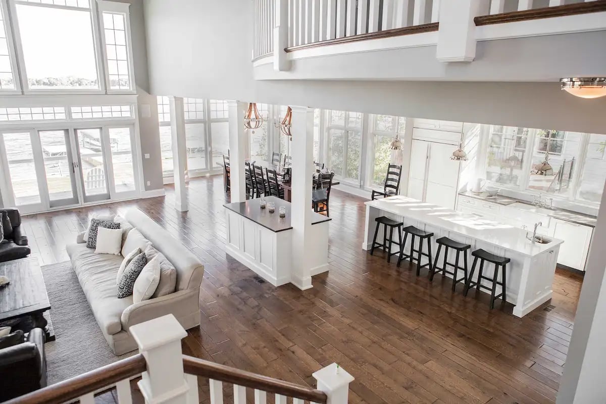 A contemporary lake house in the Chicago area featuring an open floor plan and double-height ceiling