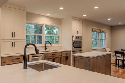 Kitchen remodeling project from behind the counter showing two sinks and the kitchen island
