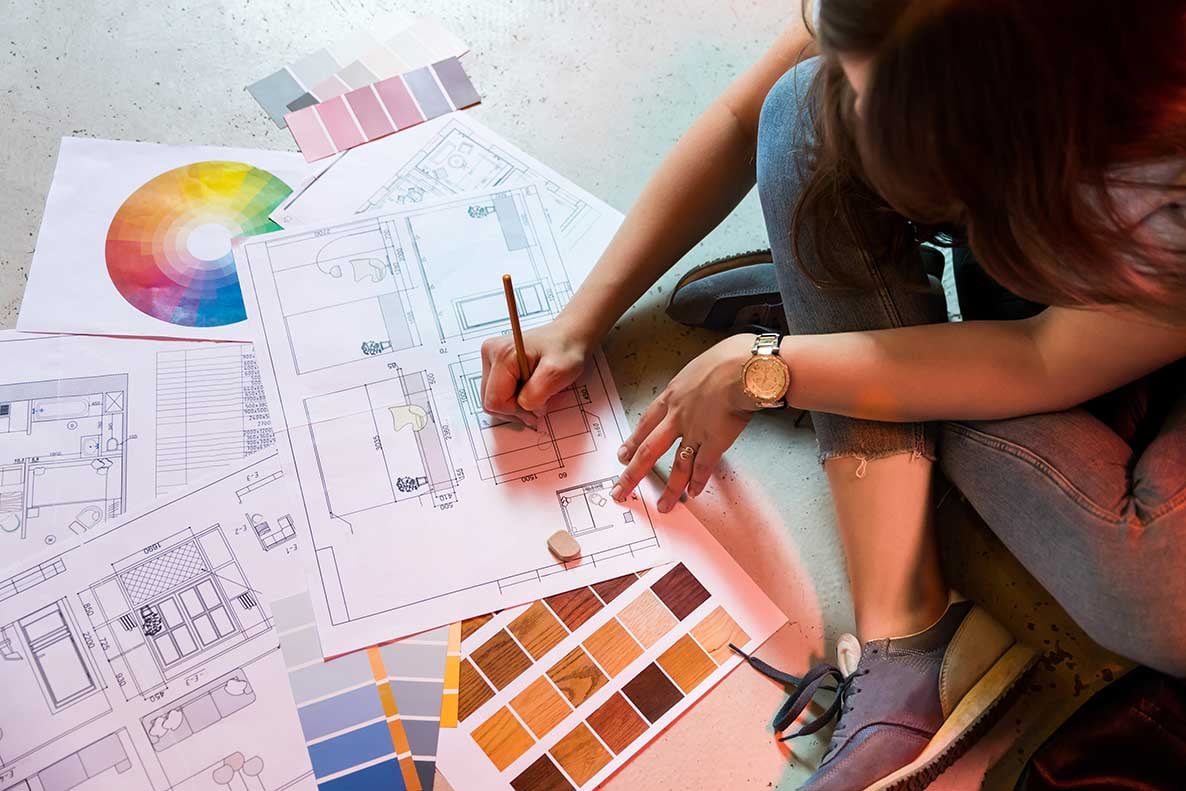 Person picking colors for remodeling plan with color swatches