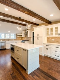 Small kitchen island with protected outlets and embedded appliances