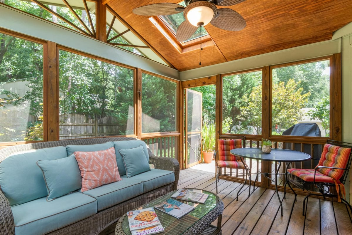 4-season room with a sitting areas and enclosed glass wall-to-windows 