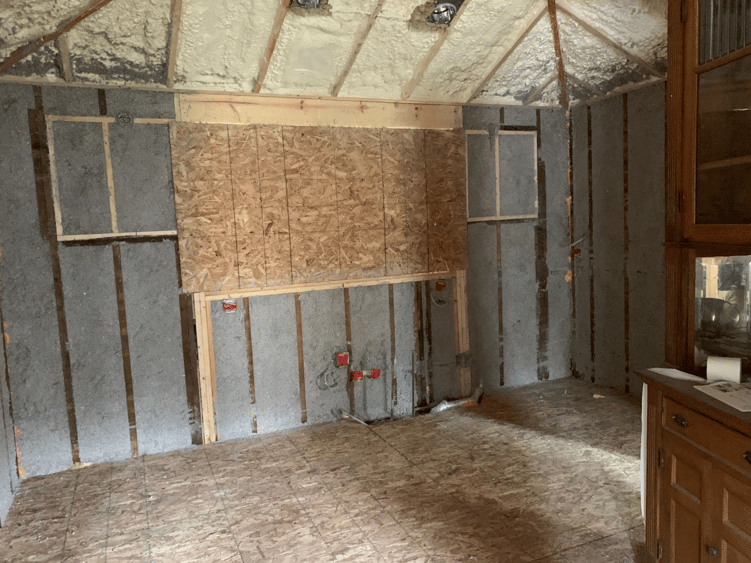 Vaulted ceilings are revealed during a kitchen remodel.