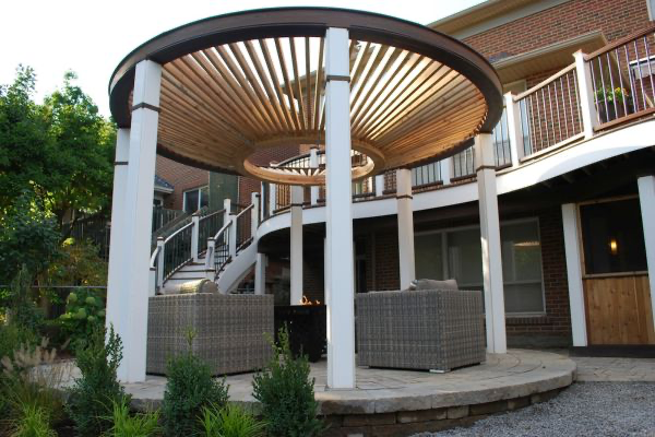 Unique round pergola above a fire table seating area