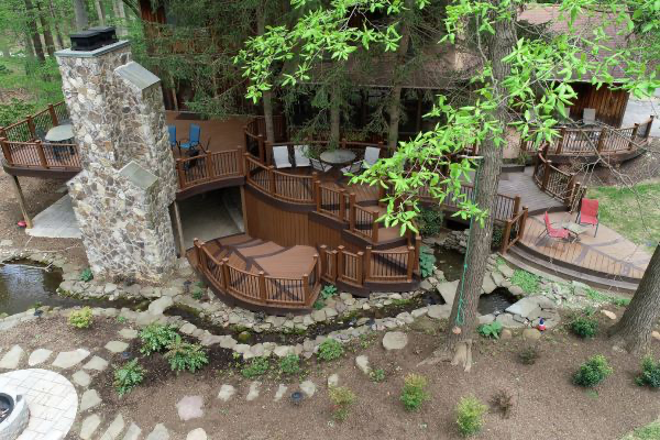 Multi-level tiered deck in a forested back yard